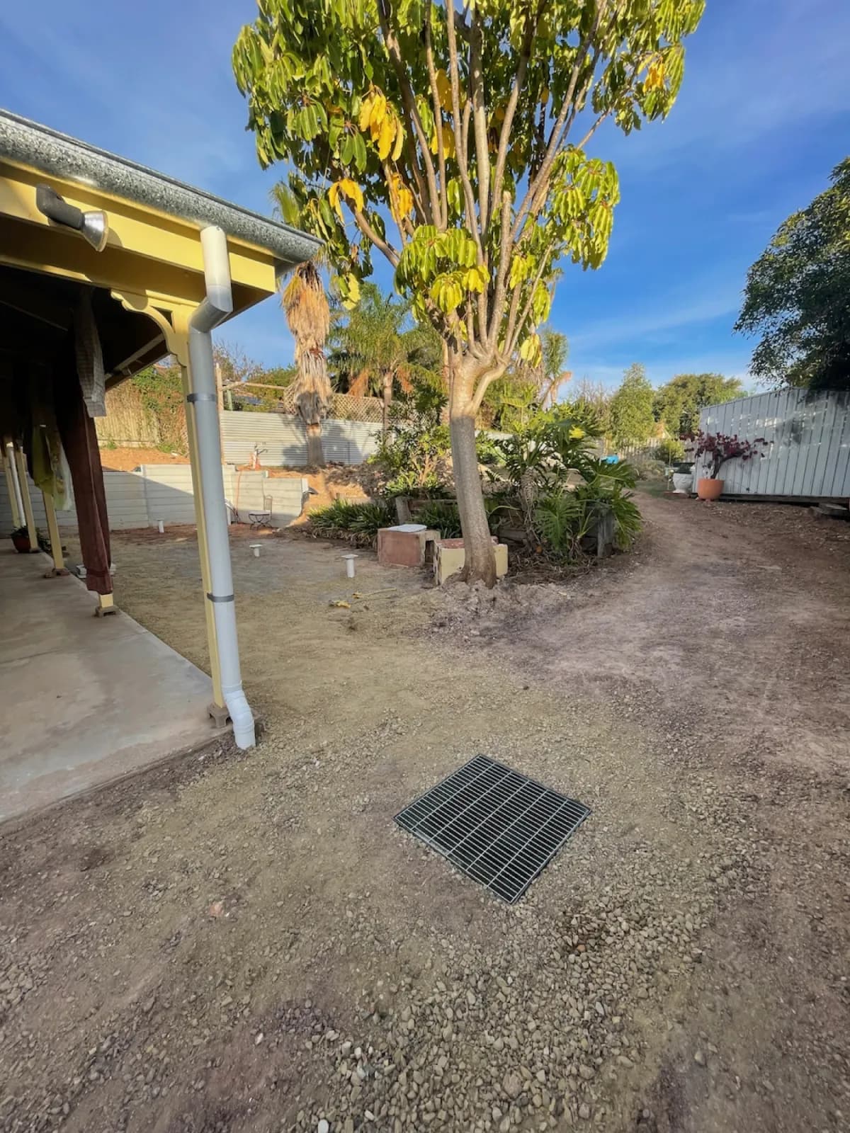 Completed sump installation with surface grates in Hallett Cove patio area